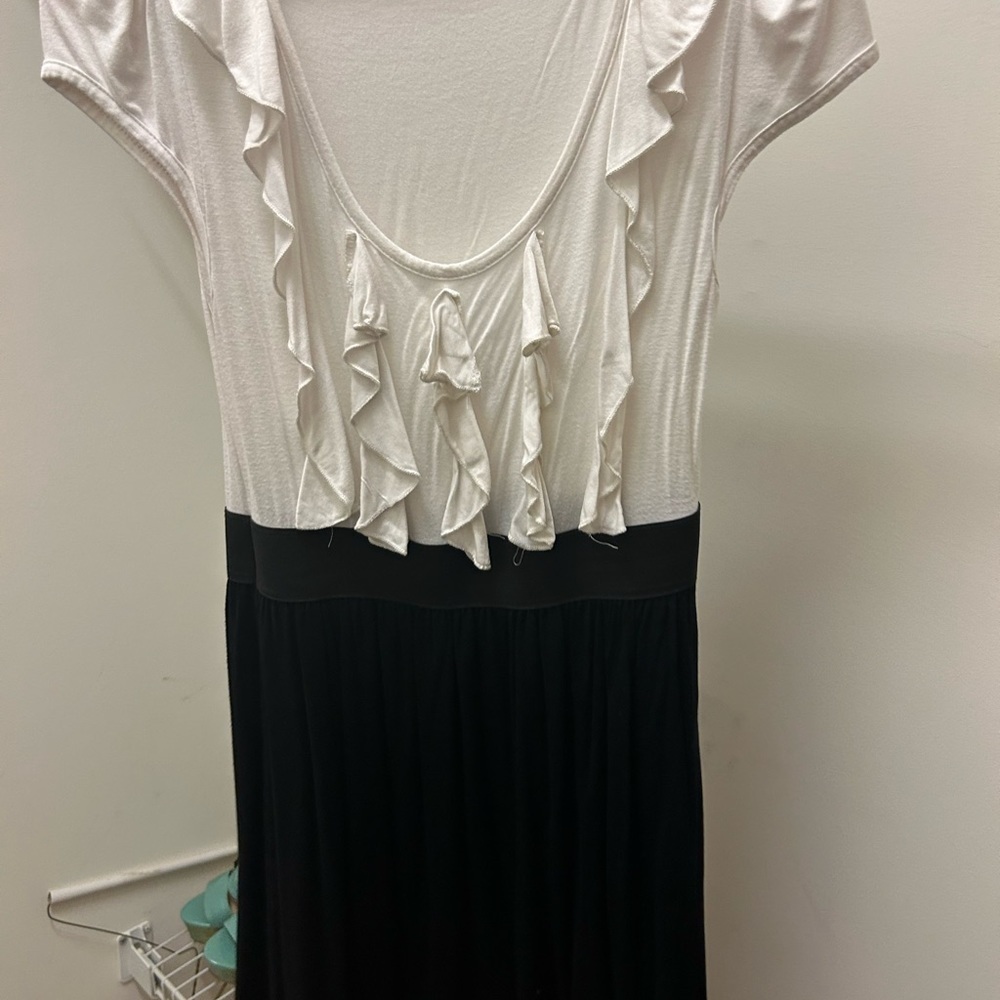 White and black dress with ruffles on chest